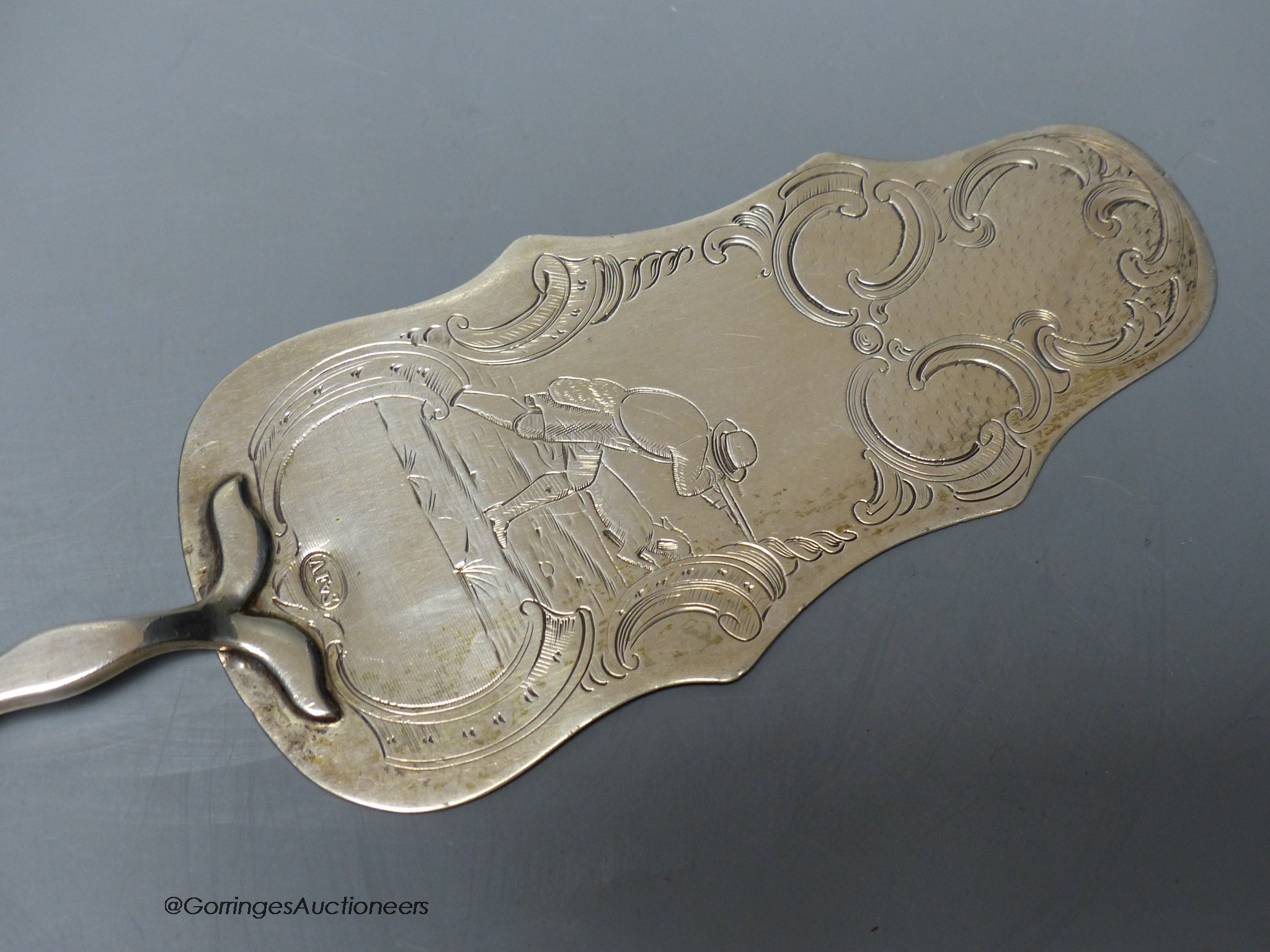 A Swedish white metal cake slice, engraved with hunting scene, 27cm.